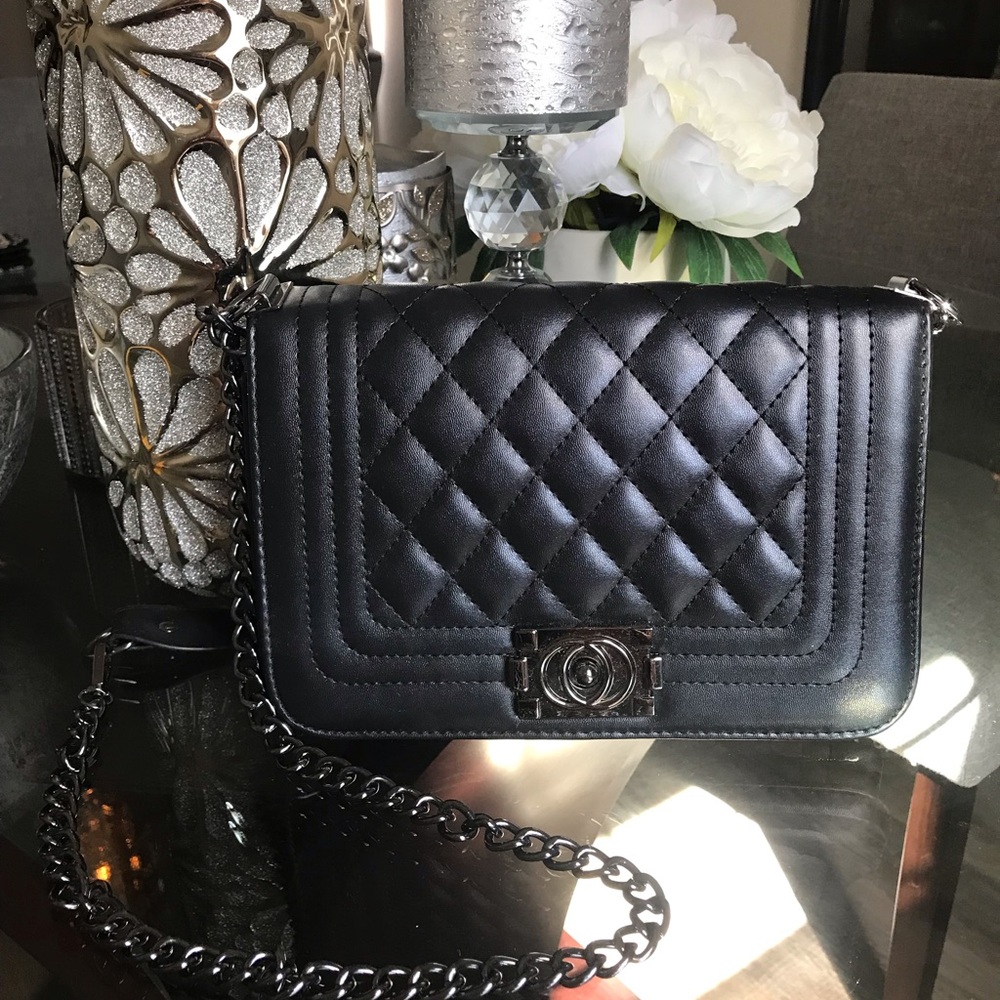 Designer look black quilted handbag with chain strap.